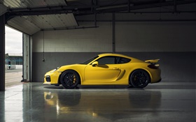Porsche Cayman GT4 желтый суперкар вид сбоку